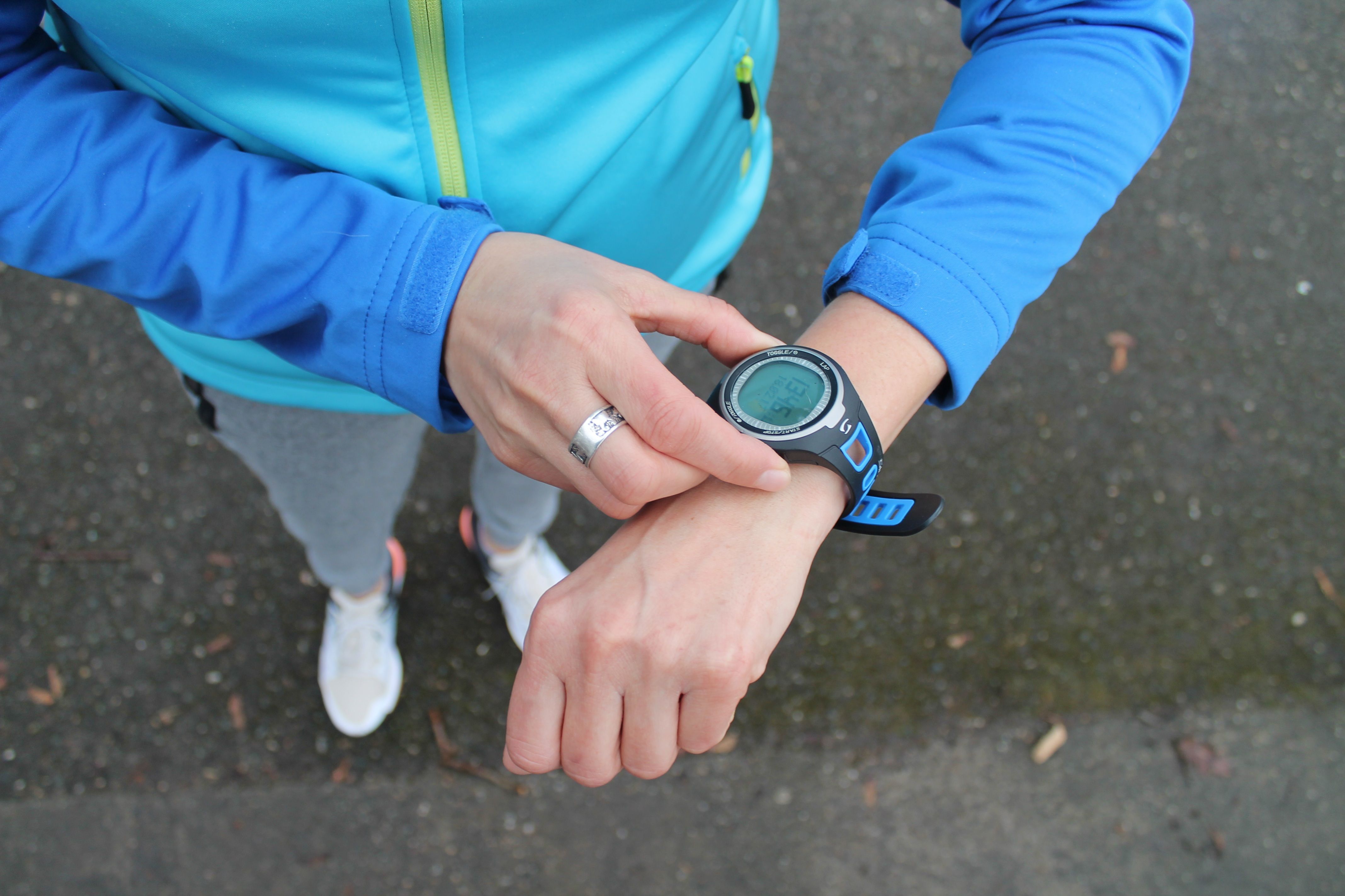 Runner checking smartwatch during training