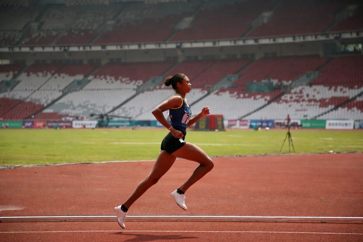 Runner demonstrating proper running form and technique